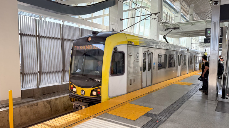 The LA Metro train arrives at one of its stations.