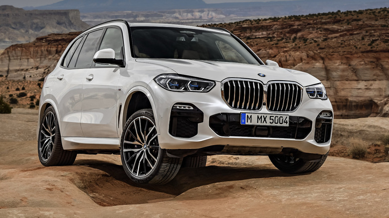White BMW X5 M parked in the desert