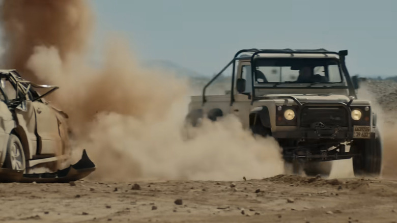 A 6x6 Land Rover drives across the desert in the Matchbox Movie trailer