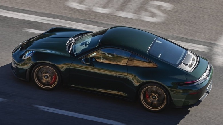 A dark green Porsche GT3 Touring seen from above